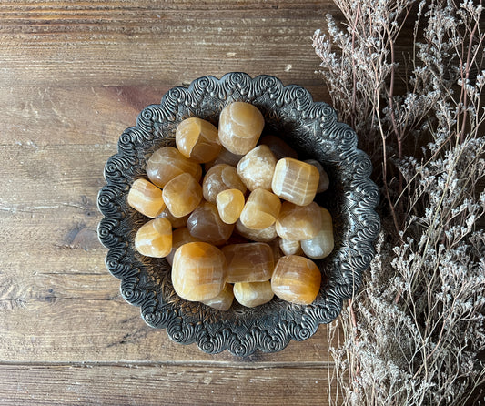 Large Polished Dark Yellow Honey Calcite Tumbled Stones. Shop Metaphysical Crystals at The Stone Maidens