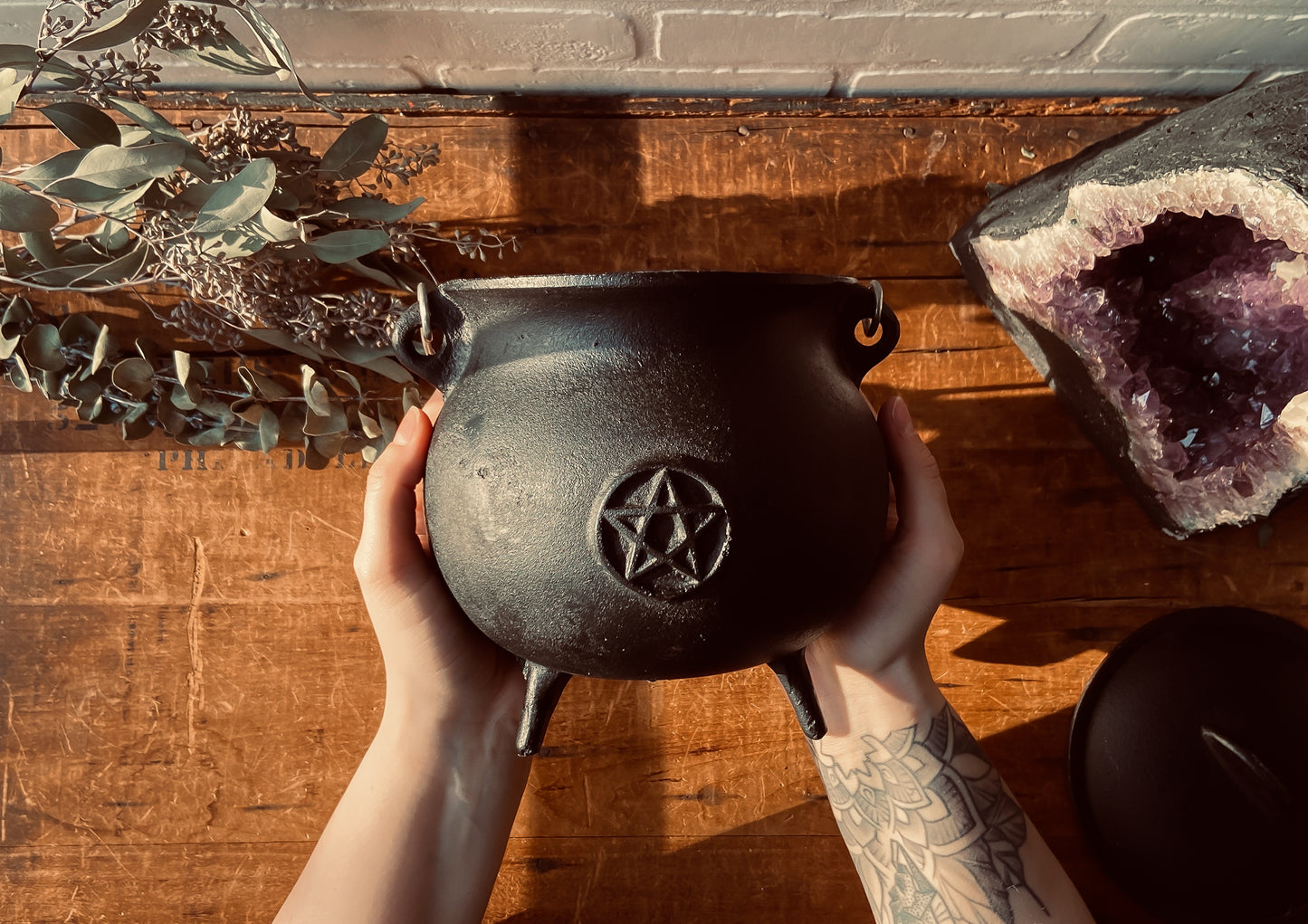 Large Black Cast Iron Cauldron sold at The Stone Maidens. 