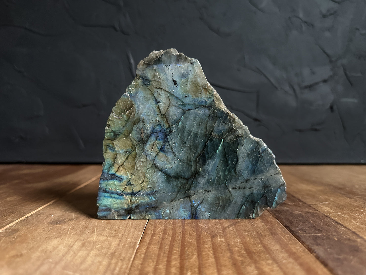 Flashy Labradorite Slab. The flashes on the face range from golden yellows to electric blues! On the back has many different shades of blue!