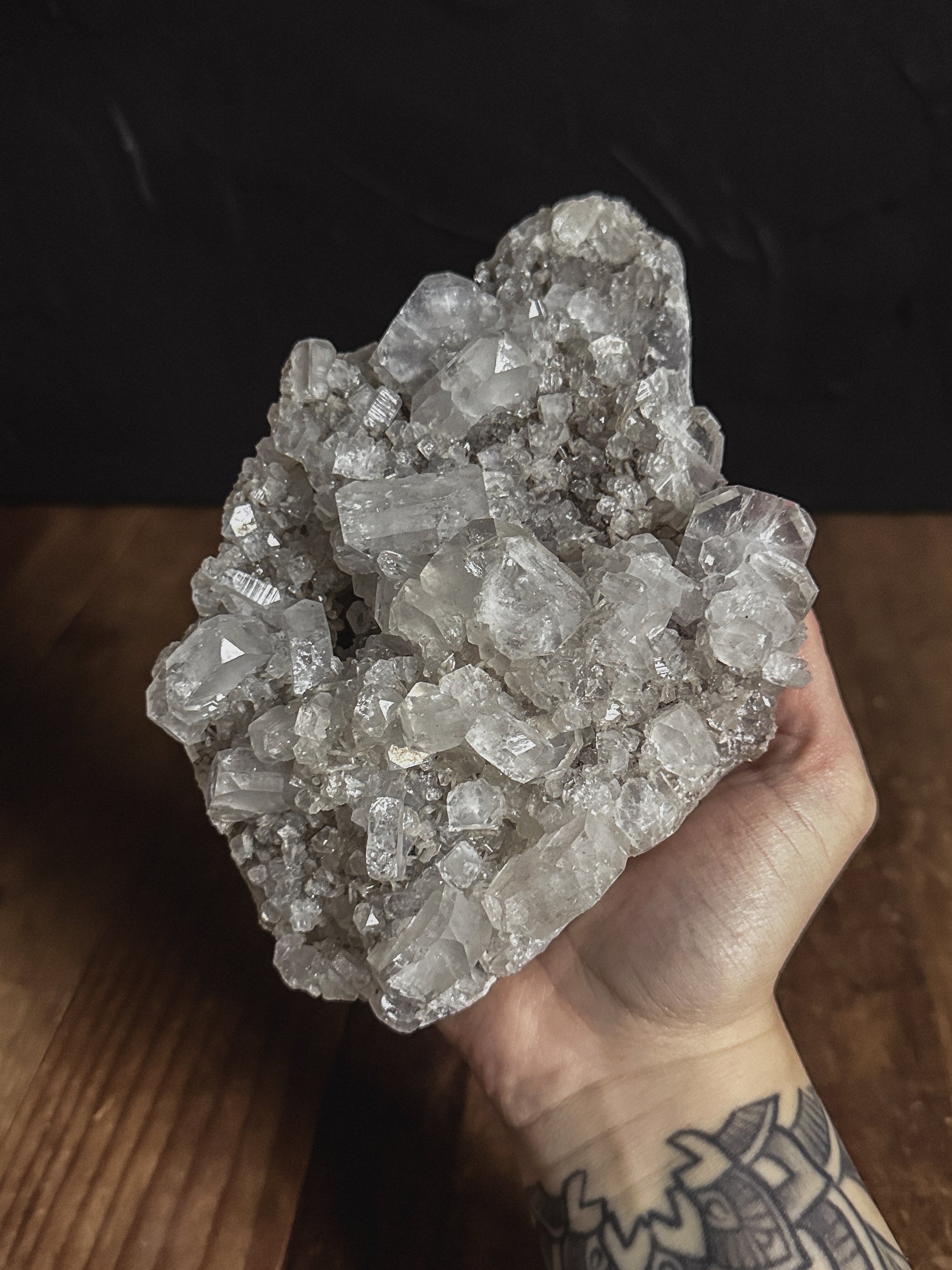 An exquisite Large Apophyllite Cluster, featuring sparkling, translucent crystals arranged in a mesmerizing formation. Perfect for adding natural elegance to any home decor or presenting as a thoughtful gift.