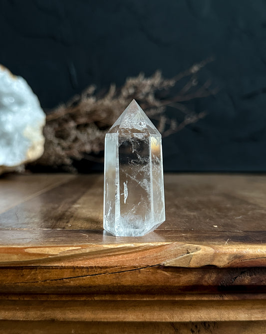 gorgeous crystal clear quartz tower sold at The Stone Maidens. Perfect for a crystal grid or used as a crystal wand. 