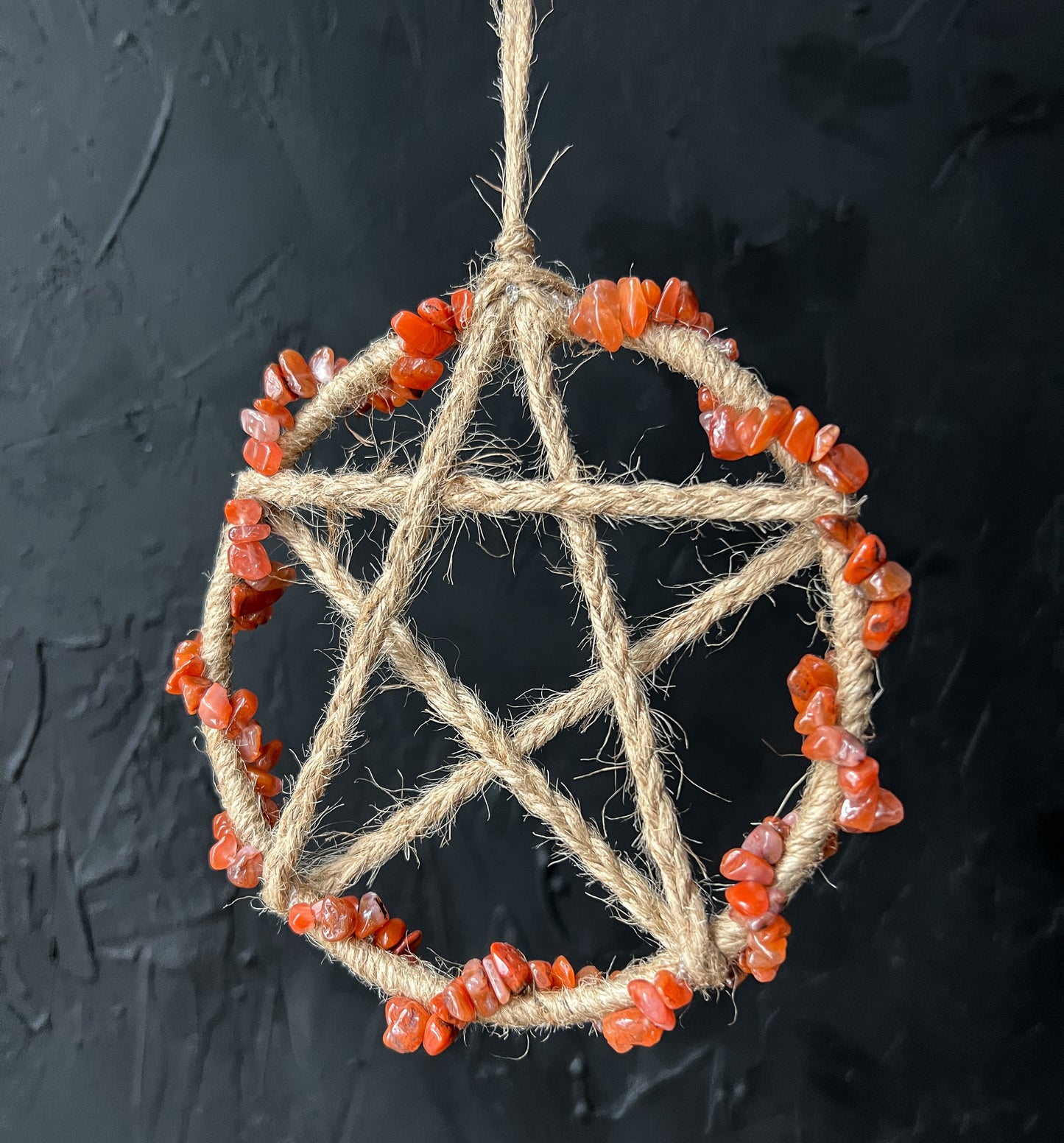 This beautiful Red Carnelian Crystal Pentacle Wall Hanging measures 5 inches.