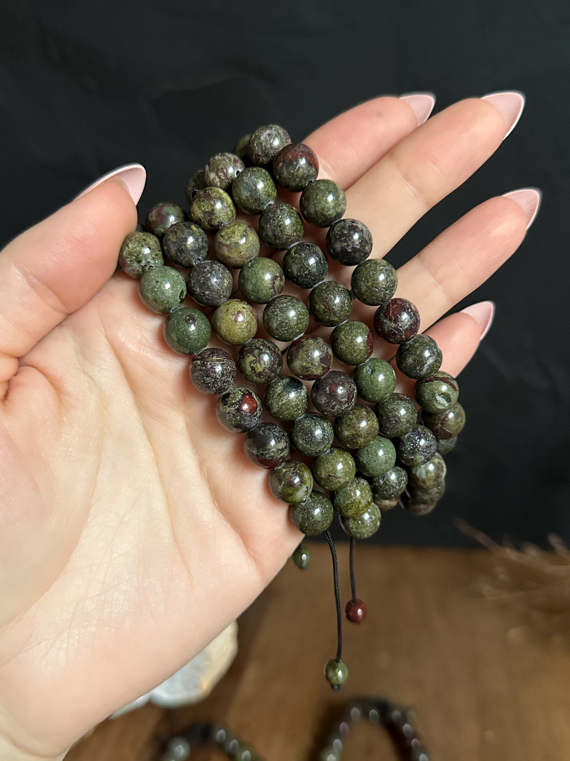 a close up shot of 10mm Dragons Blood Jasper Adjustable Bracelets from The Stone Maidens. A wonderful meditation tool.