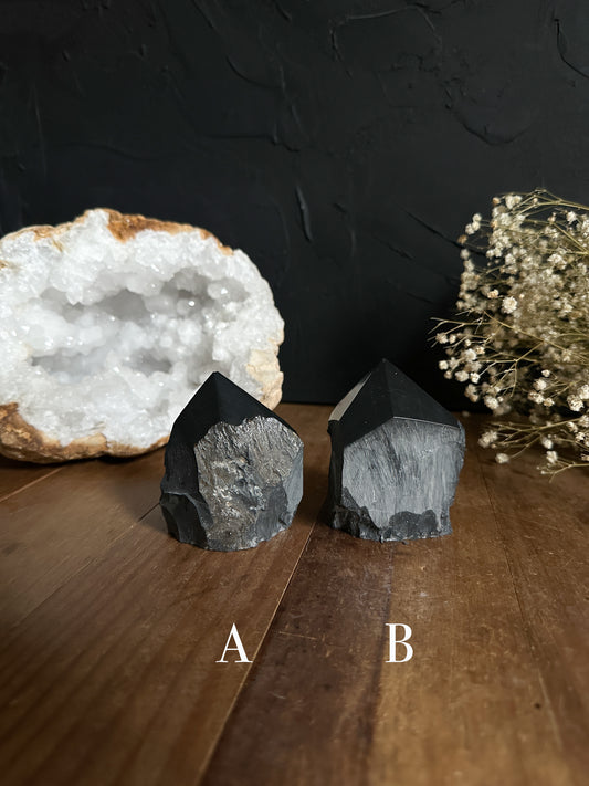 These beautiful Onyx Top Points are embellished with shimmering Pyrite throughout. Offered at a reduced price due to its minor flaw, Chipped Tip, allowing you to acquire a piece of nature's beauty at a more affordable cost.