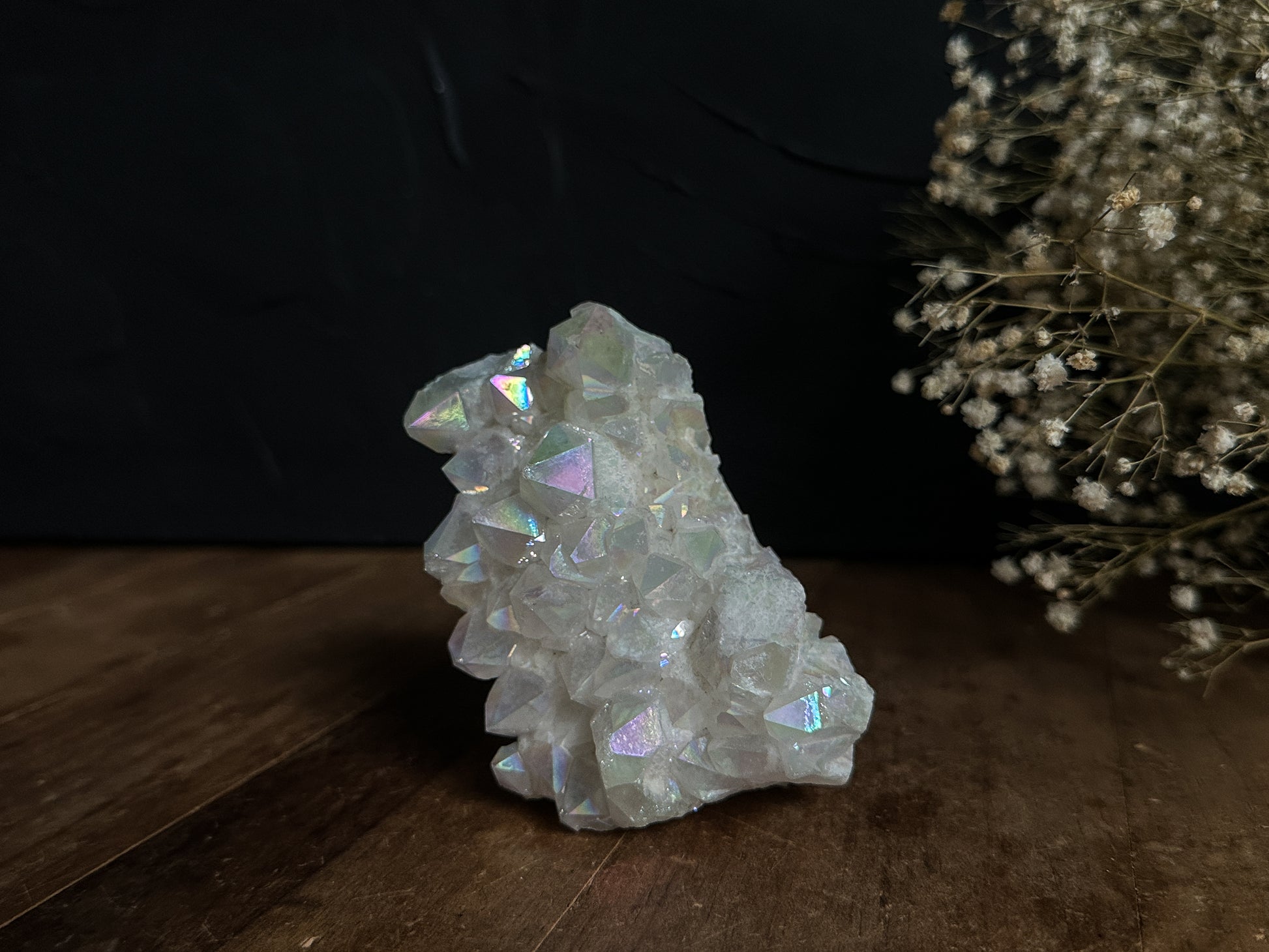 An exquisite Angel Aura Quartz Cluster, intricately formed and reflecting the divine beauty of the cosmos