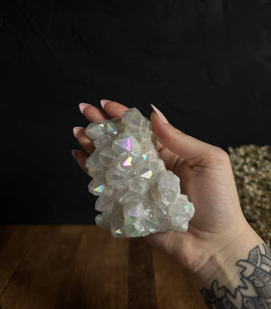 Large Angel Aura Quartz Cluster, featuring sparkling, translucent crystals arranged in a mesmerizing formation.