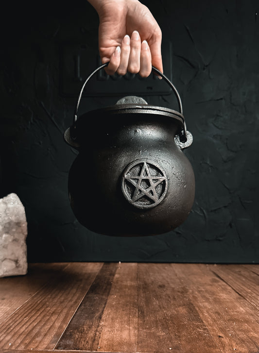 Close-up photograph of a Large Black cast iron cauldron with a pentacle, perfect for rituals, incense burning, and adding a touch of magic to your space