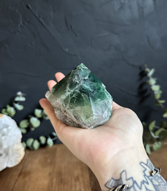 Mostly Green Fluorite with a few little spots of hints of purple in this Fluorite Top Polished Point. 
