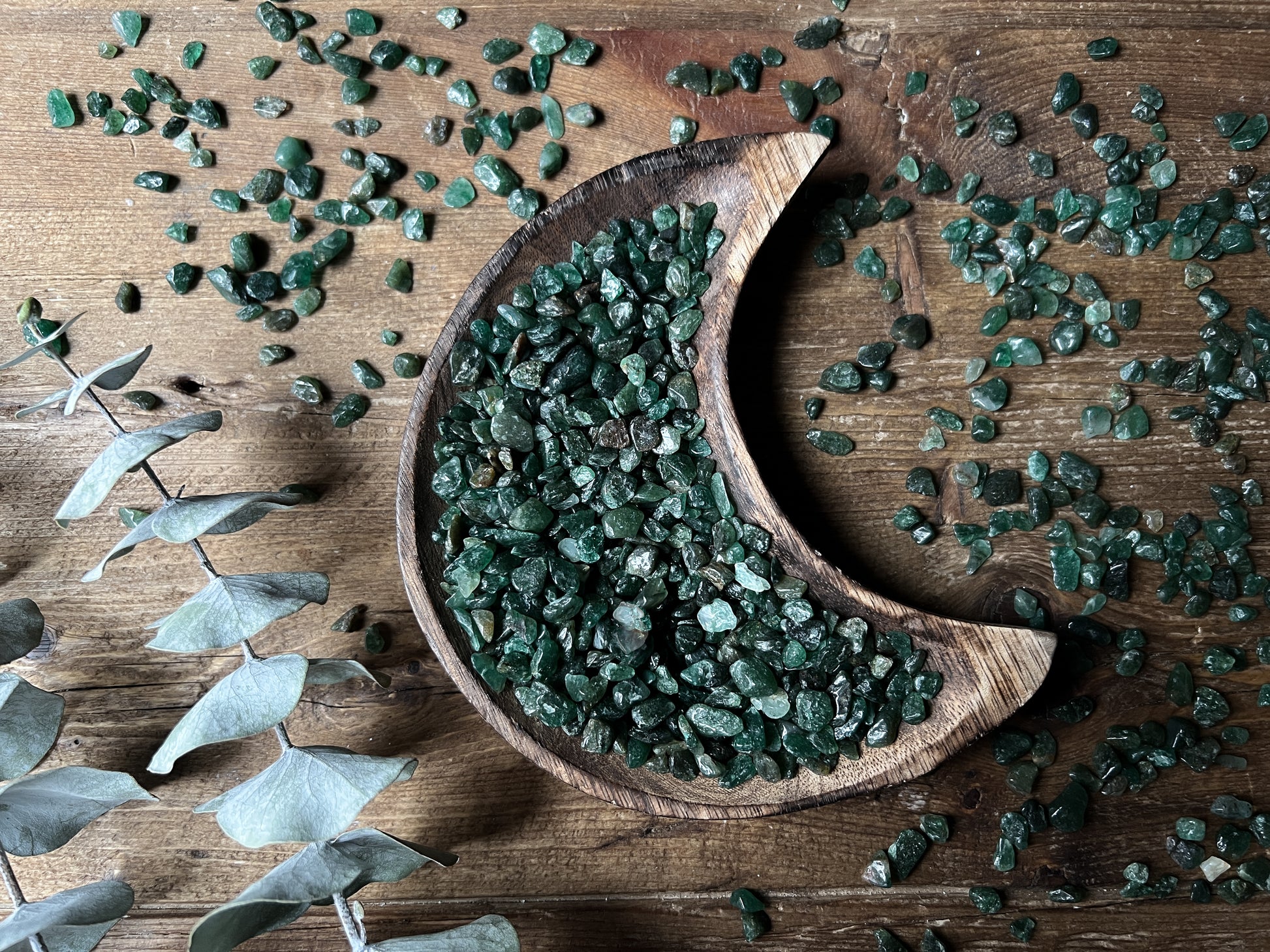 These Emerald Crystal Chips are displayed in a wood moon bowl.