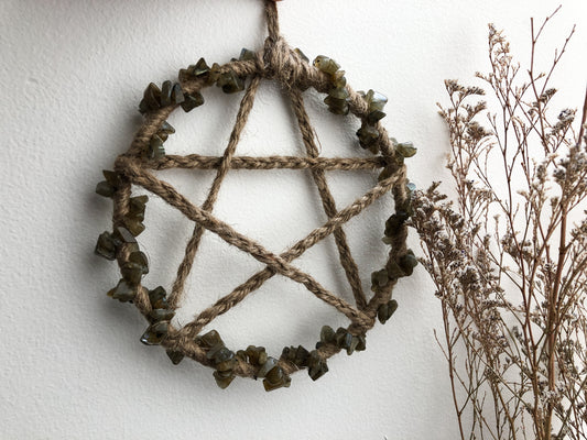 This Magical Labradorite Crystal Pentacle Wall Hanging measures 5 inches.