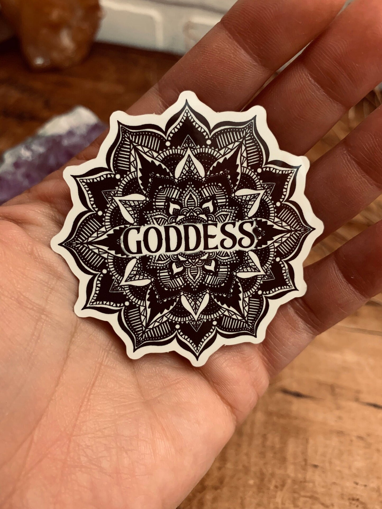 A black and white Mandala with the word Goddess in the center Sticker