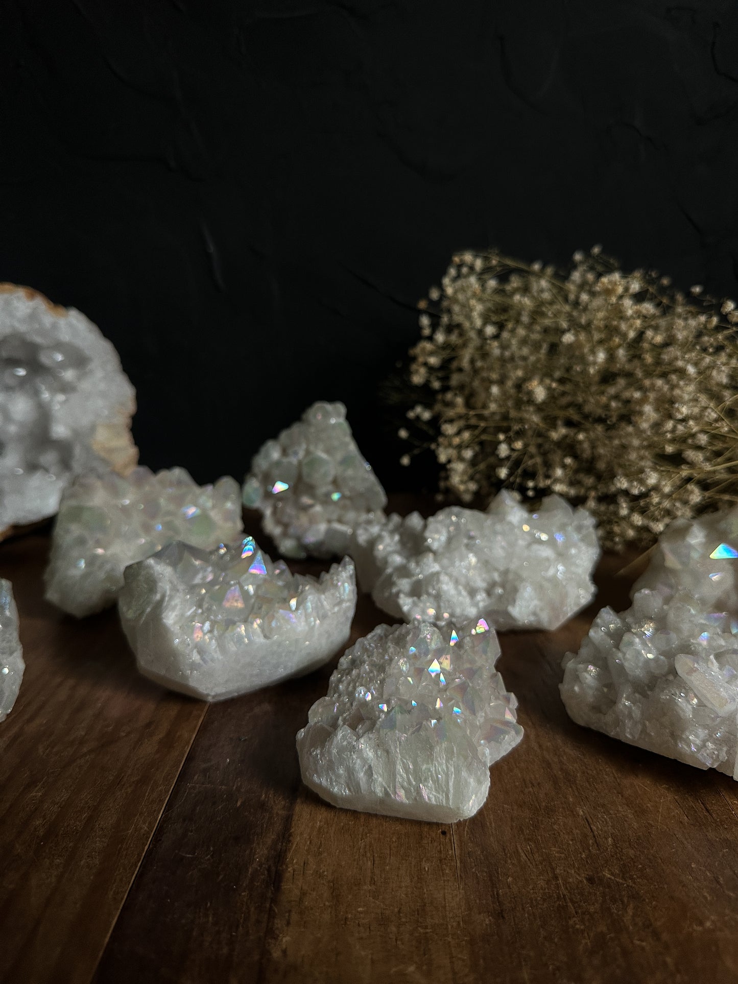 Radiant Angel Aura Quartz Clusters shimmer with a heavenly glow, reflecting soft pinks, blues, and purples. These mesmerizing specimens bring a touch of magic to any environment, making them a perfect statement piece for home decor or a heartfelt present for someone special