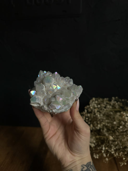 Radiant Angel Aura Quartz Clusters shimmer with a heavenly glow, reflecting soft pinks, blues, and purples. These mesmerizing specimens bring a touch of magic to any environment, making them a perfect statement piece for home decor or a heartfelt present for someone special