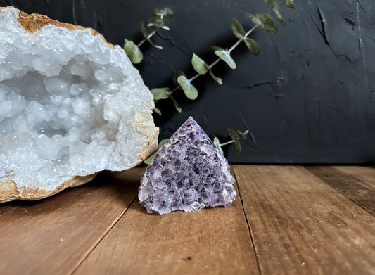 This piece of Amethyst is truly one of a kind with the base of its points being a deep purple while the tips fade to a hazy light purple.
