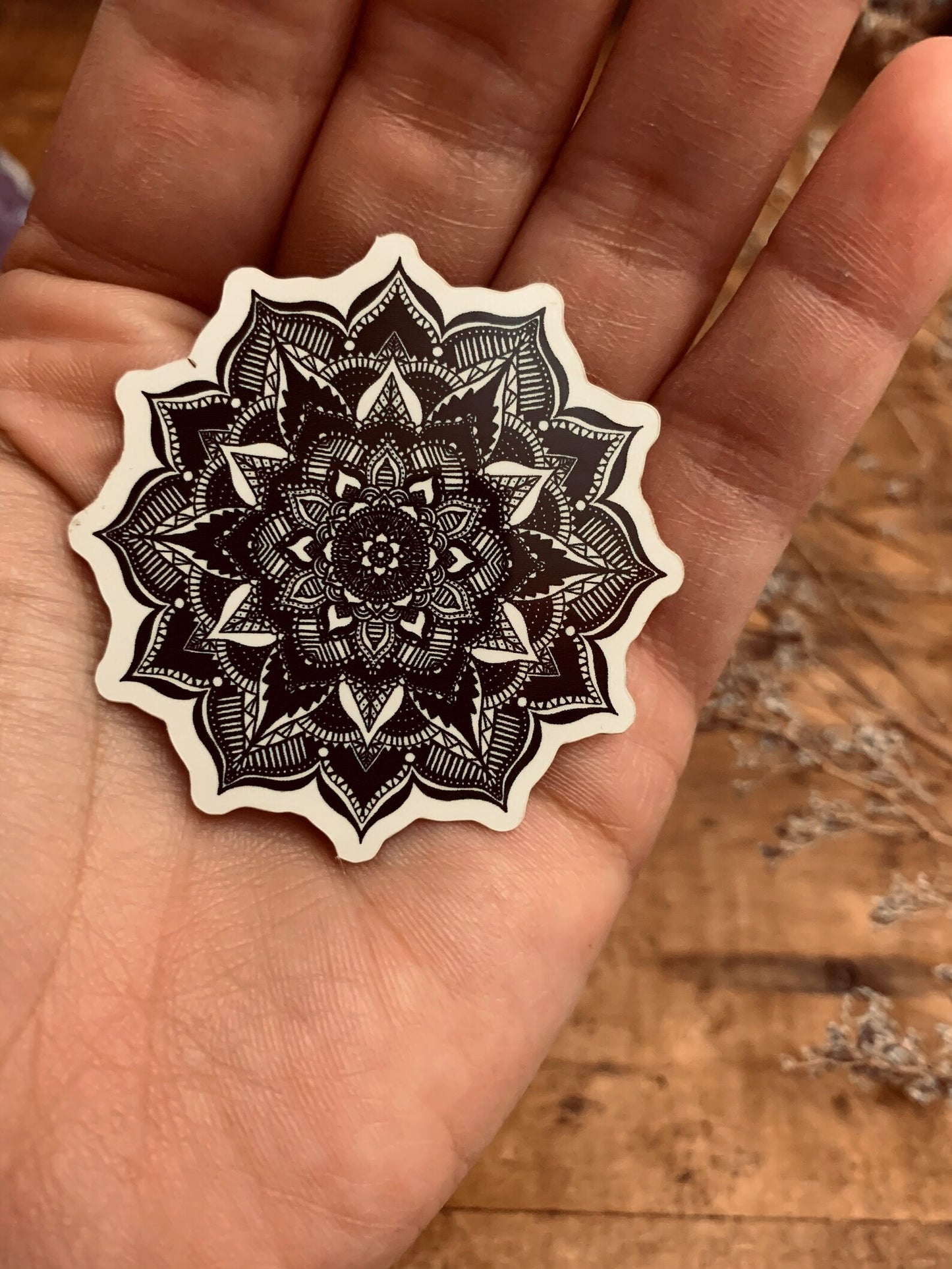 A mesmerizing black and white Mandala sticker. Handmade by The Stone Maidens